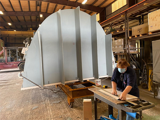 Power plant waterbox internal coating; Curran technician preparing blast mask to protect gasket sealing surfaces prior to grit blast surface prep and application of Carboline epoxy.